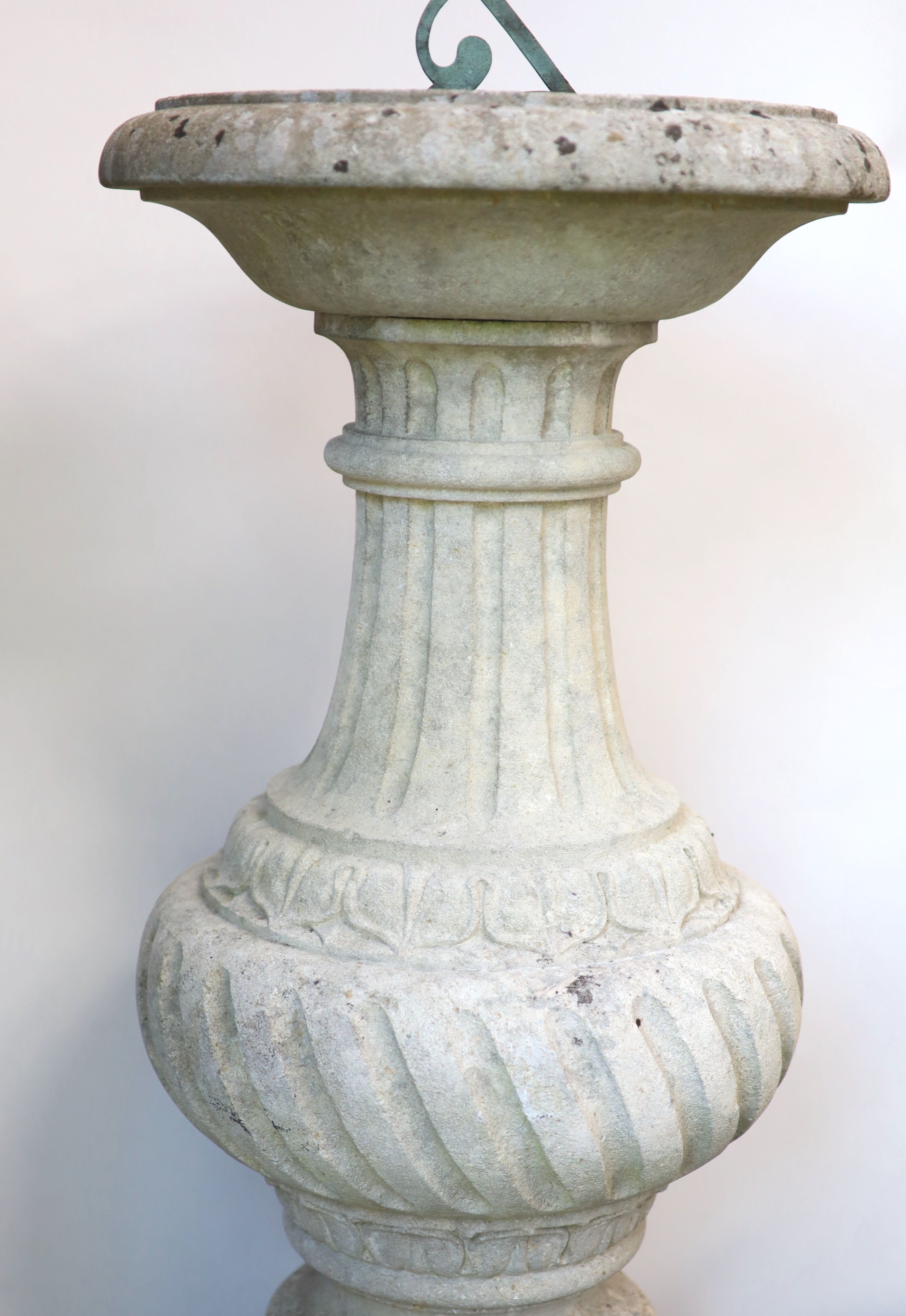An Edwardian bronze sundial of octagonal form, on a carved stone base H 100cm. W 47cm.